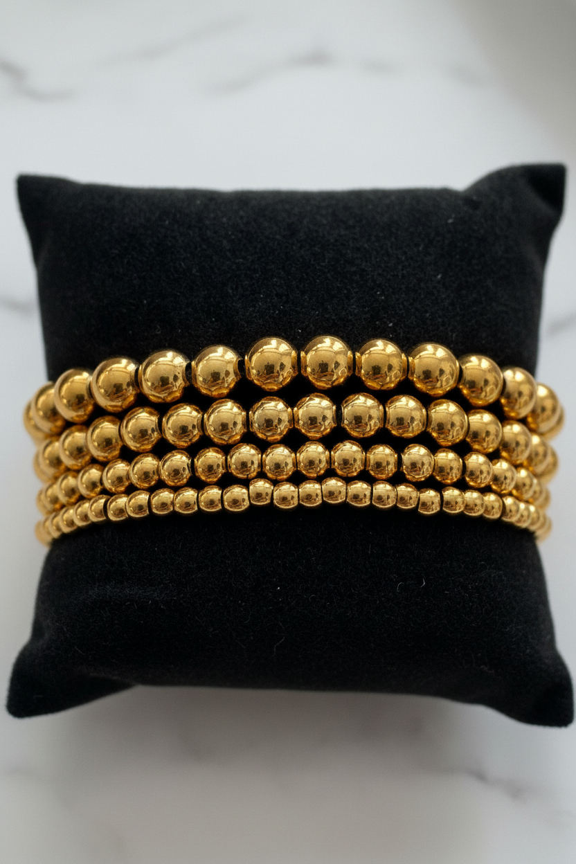 Gold Beaded Bracelets Close-up Marble