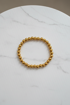 Gold Bracelet on Marble