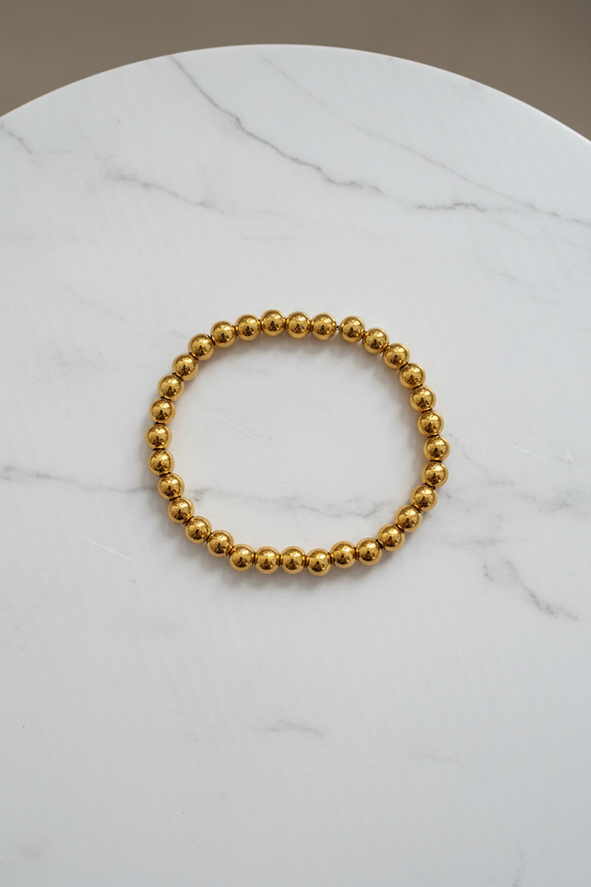 Gold Bracelet on Marble